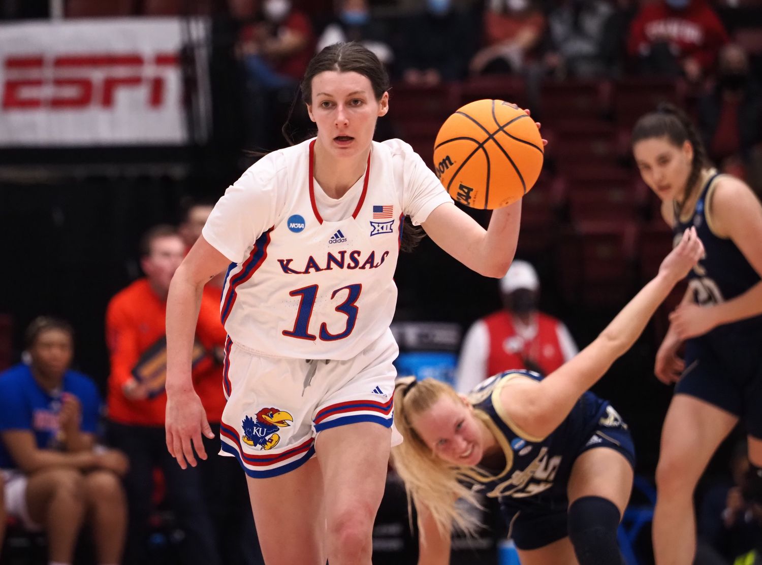 Mar 18, 2022; Stanford, California, USA; Kansas Jayhawks guard Holly Kersgieter (13) on a fast break after stealing the ball against Georgia Tech Yellow Jackets forward Digna Strautmane (45) during the second quarter at Maples Pavilion. Mandatory Credit: Kelley L Cox-USA TODAY Sports